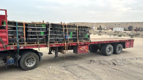 Loaded flatbed leaving the yard